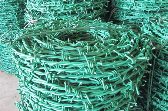 Barbed wire rolls for border barriers used with posts